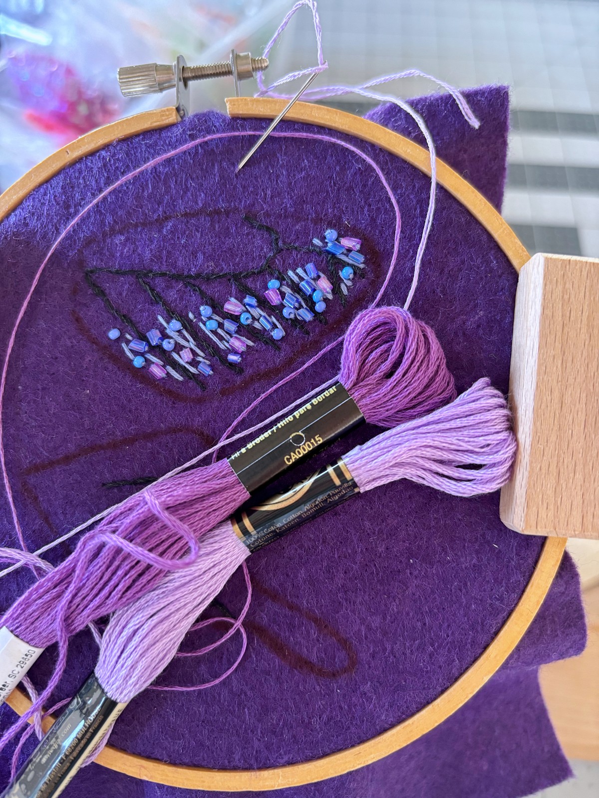 Light purple and dark purple embroidery thread added to wings.