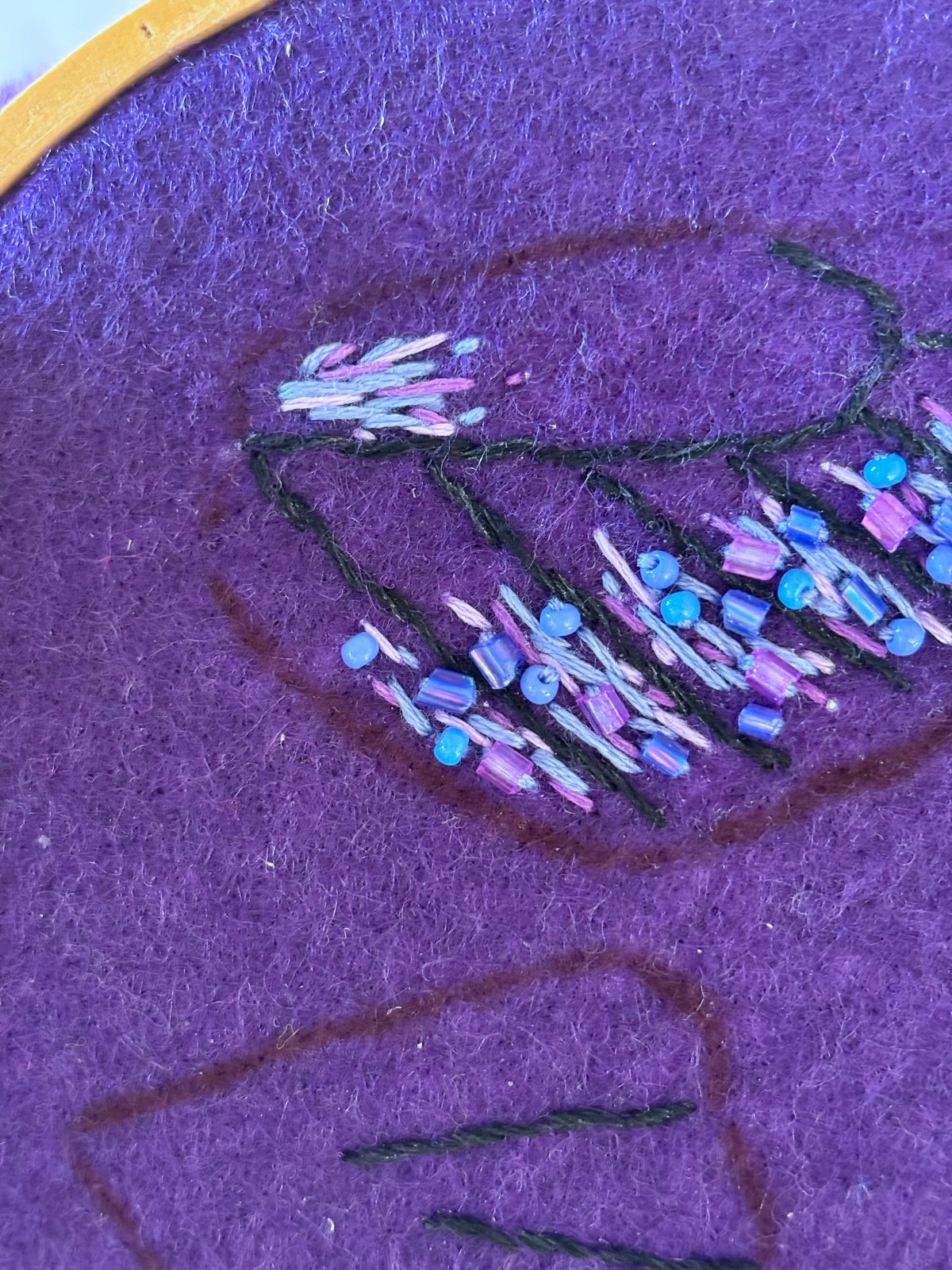 Top wing with all of the embroidered and bead details.