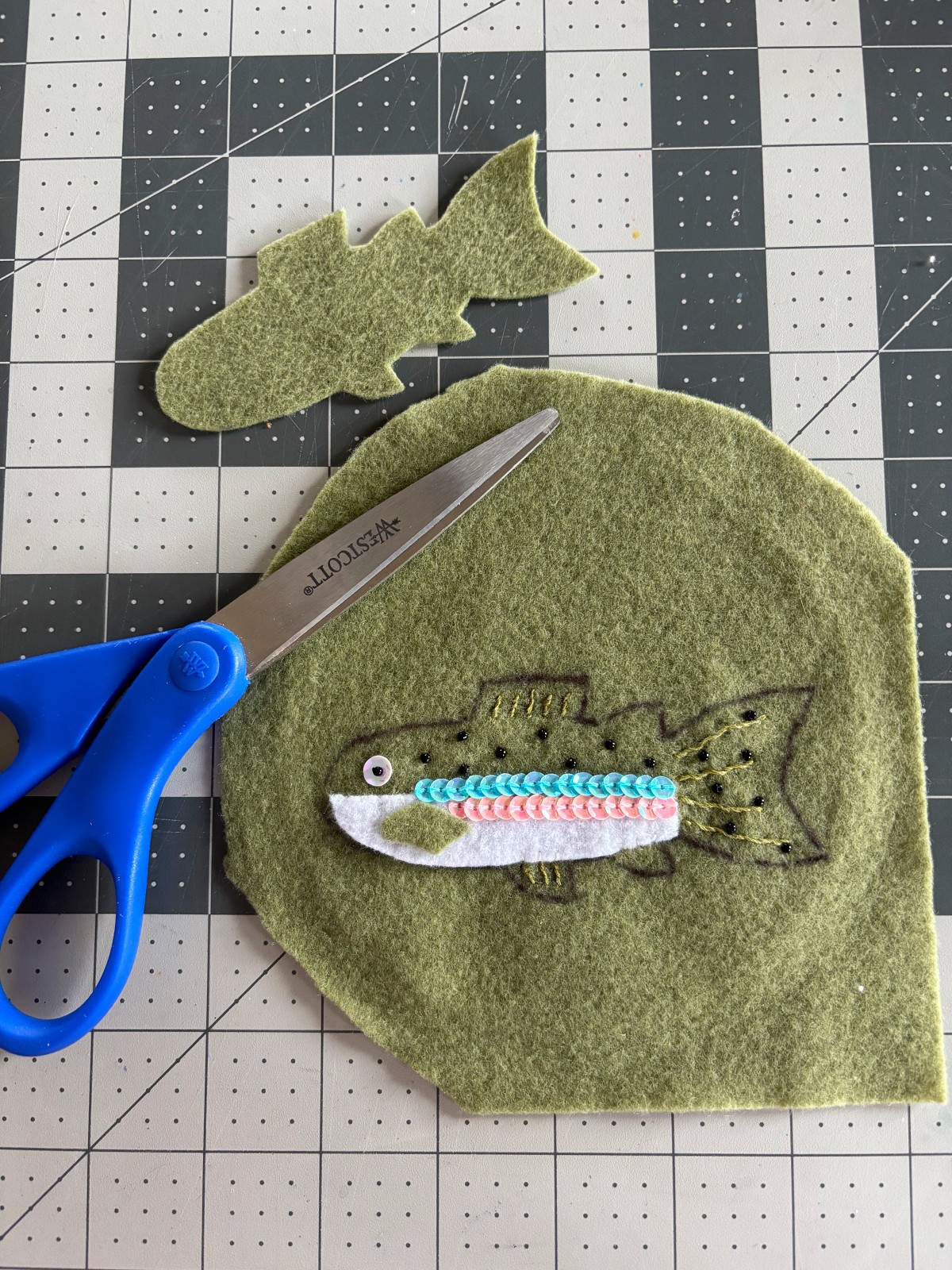 Trout body out of the embroidery hoop ready to be cut out.