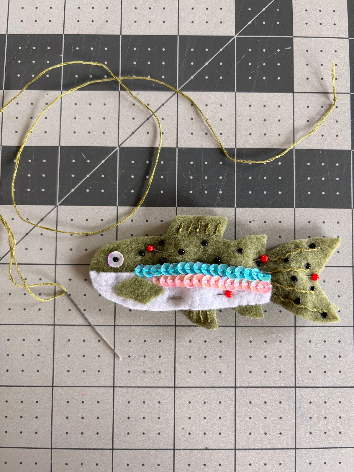 Rainbow trout body pinned to the back piece.