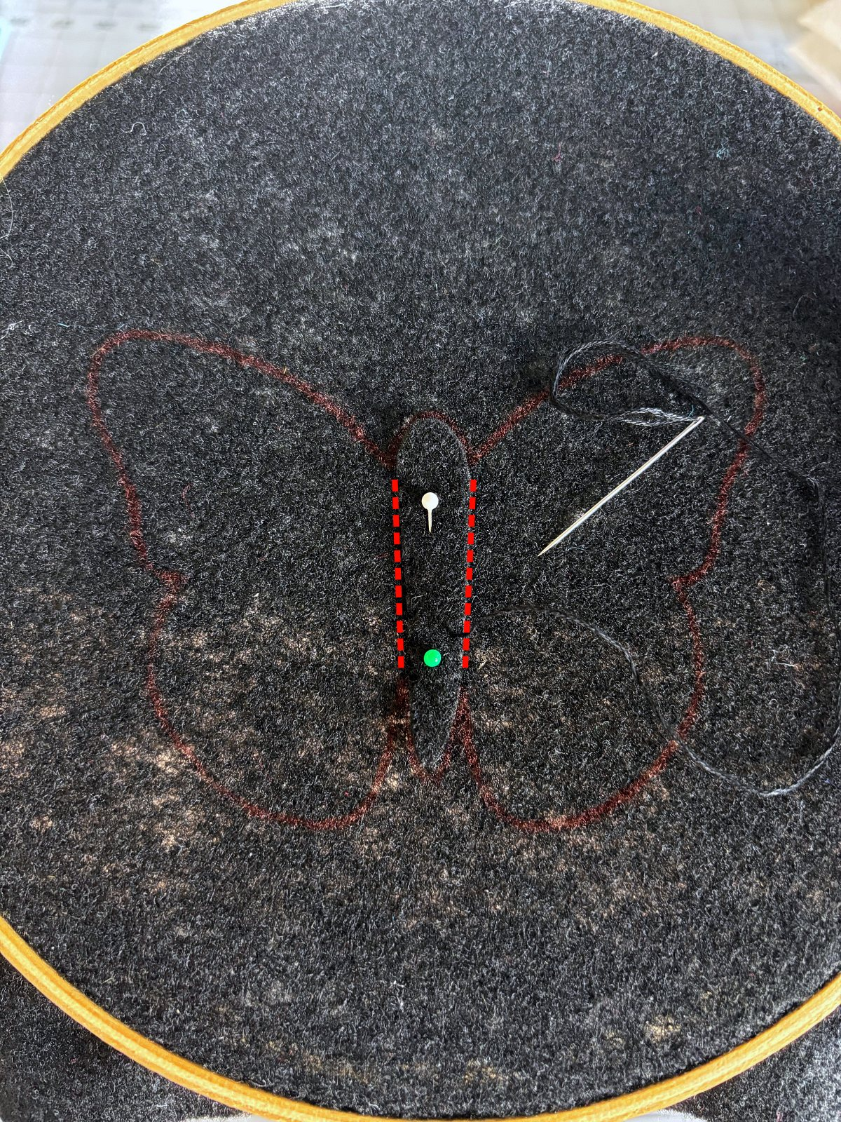 Butterfly body pinned in place with guide lines showing where to sew.