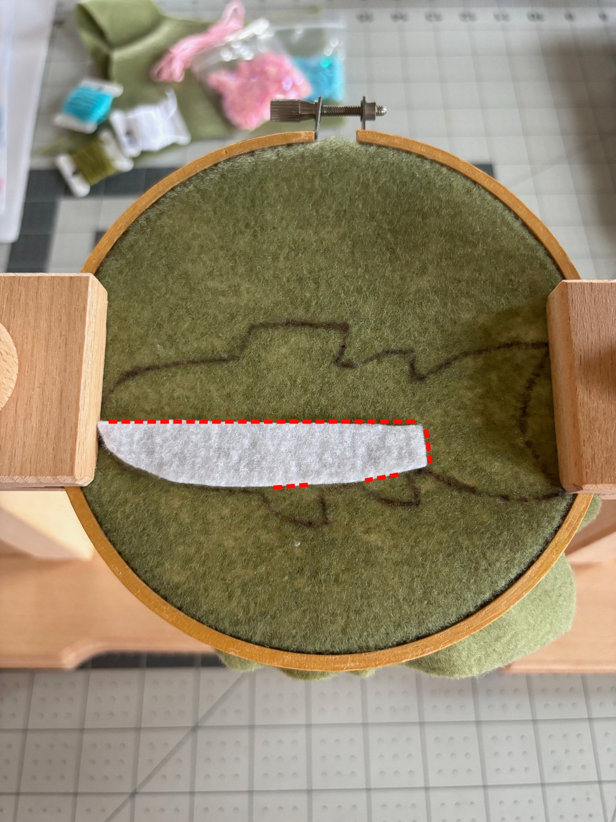 Trout belly pattern piece with sewing line indications in red.