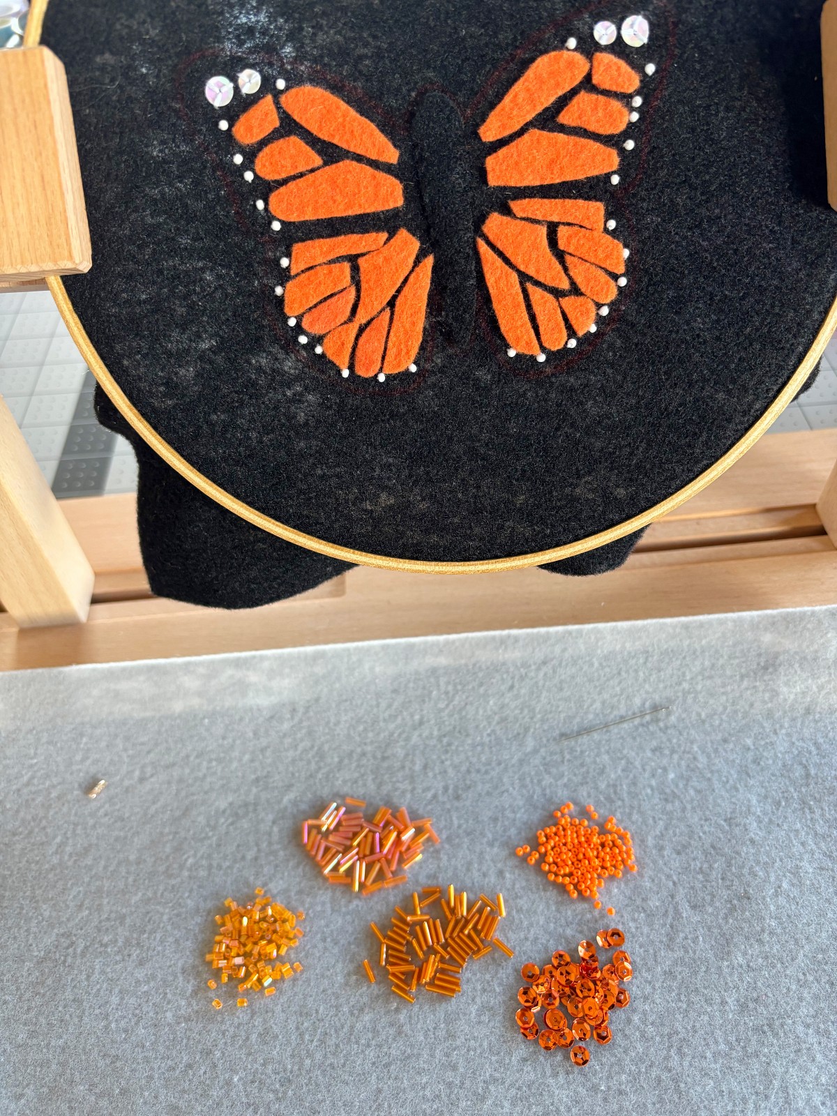 Orange beads laid out on the table.