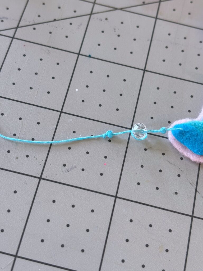 Tying a knot with embroidery thread.