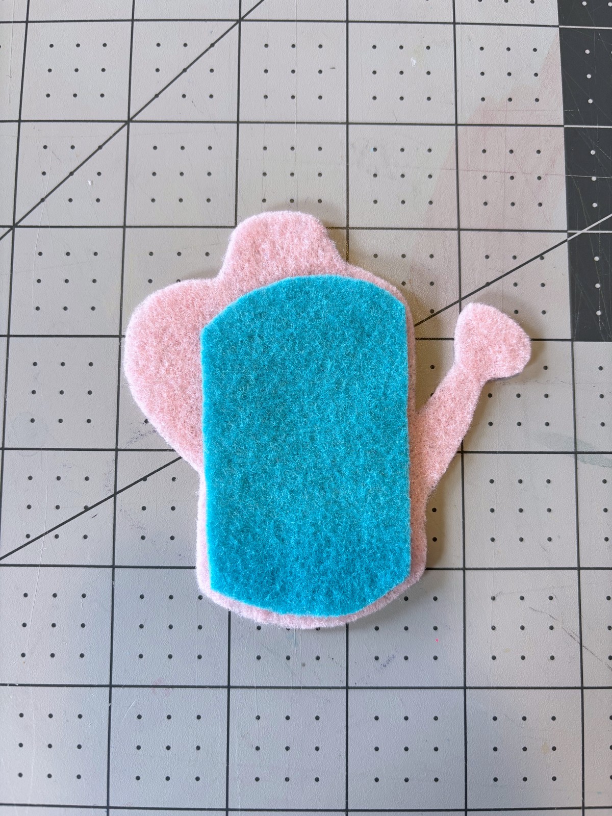 watering can piece arranged on top of watering can base.