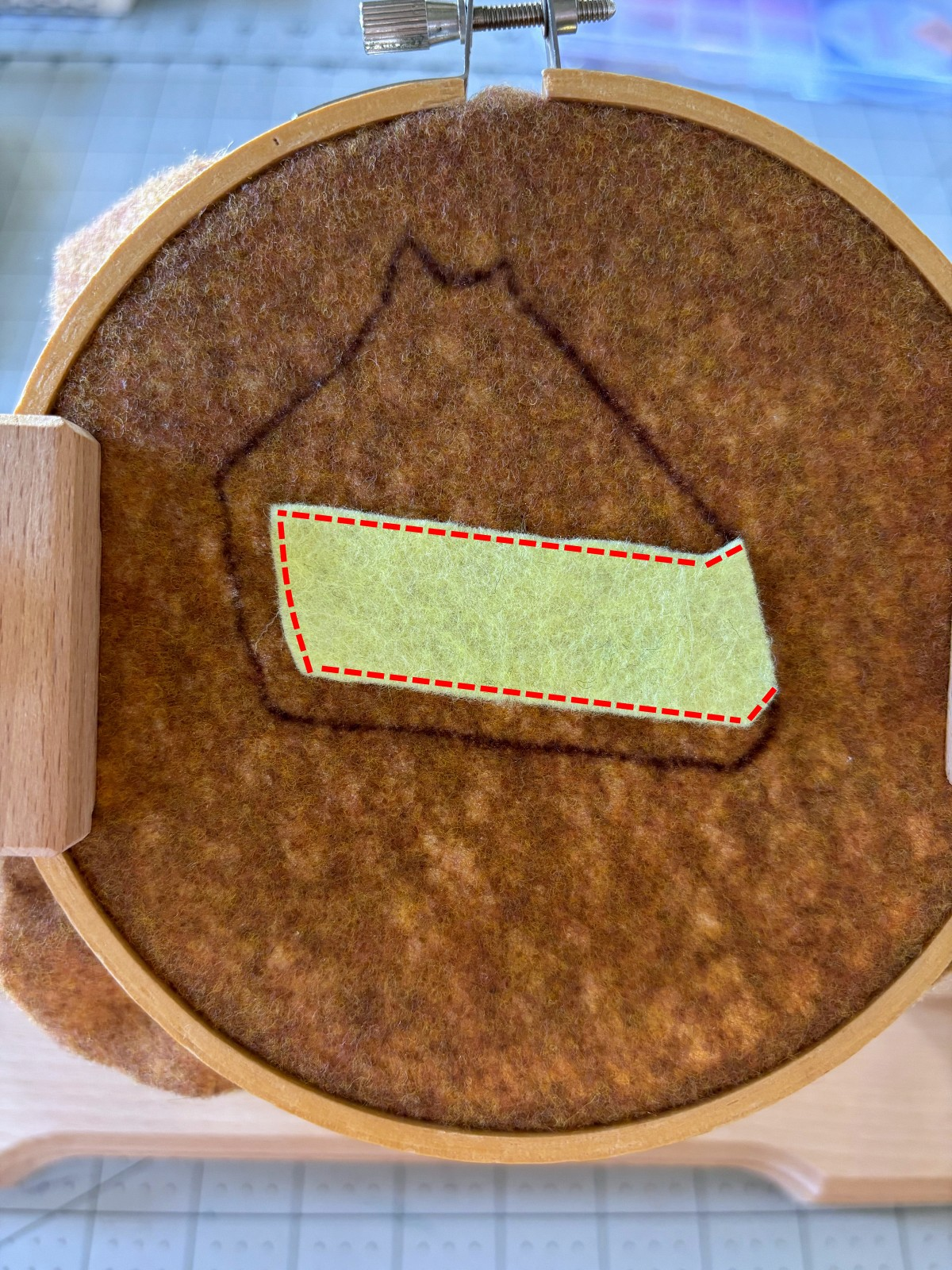 Pie filling layer placed on top of brown base with sewing guide lines.