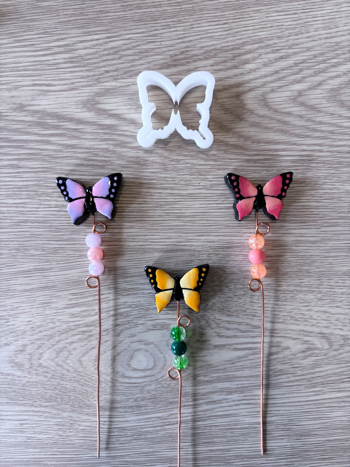 Butterfly plant sticks and clay cutter.