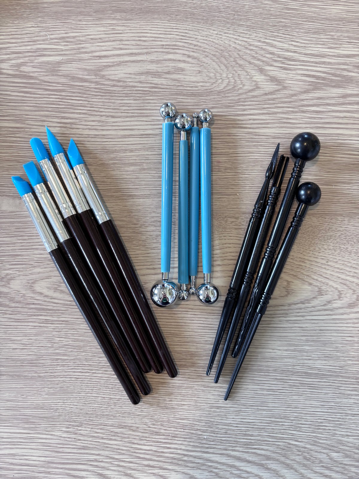 Sculpting tools spread out on a table.