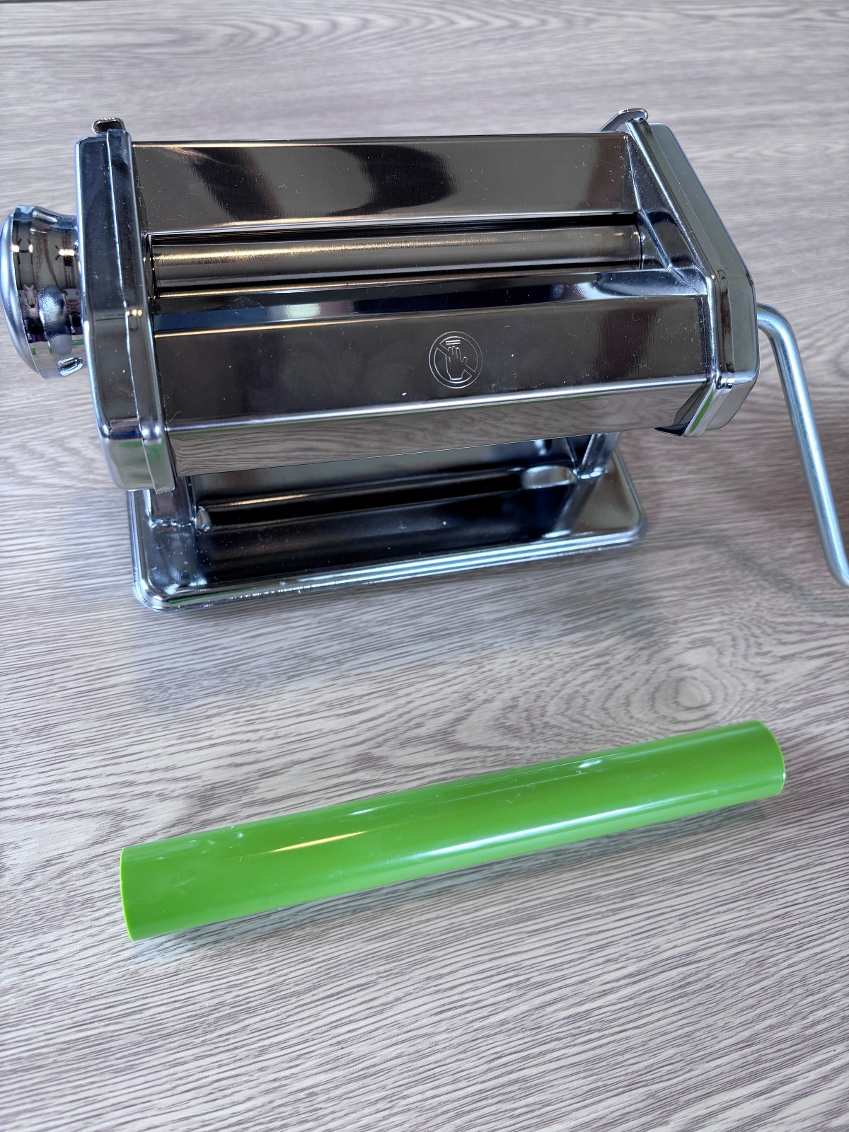 Polymer clay rolling machine and green rolling pin.