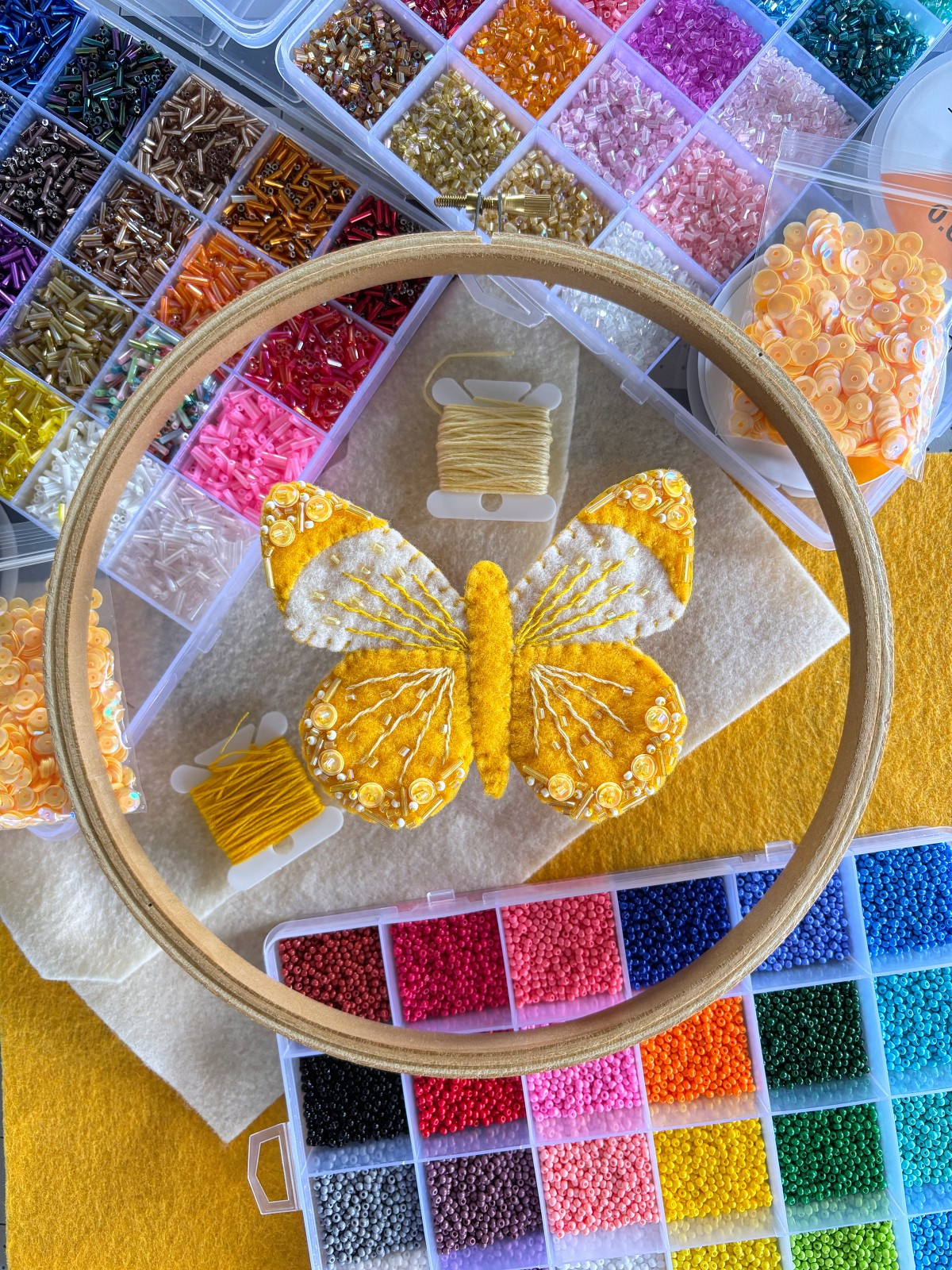 All the craft supplies I used and the finished butterfly ornament.