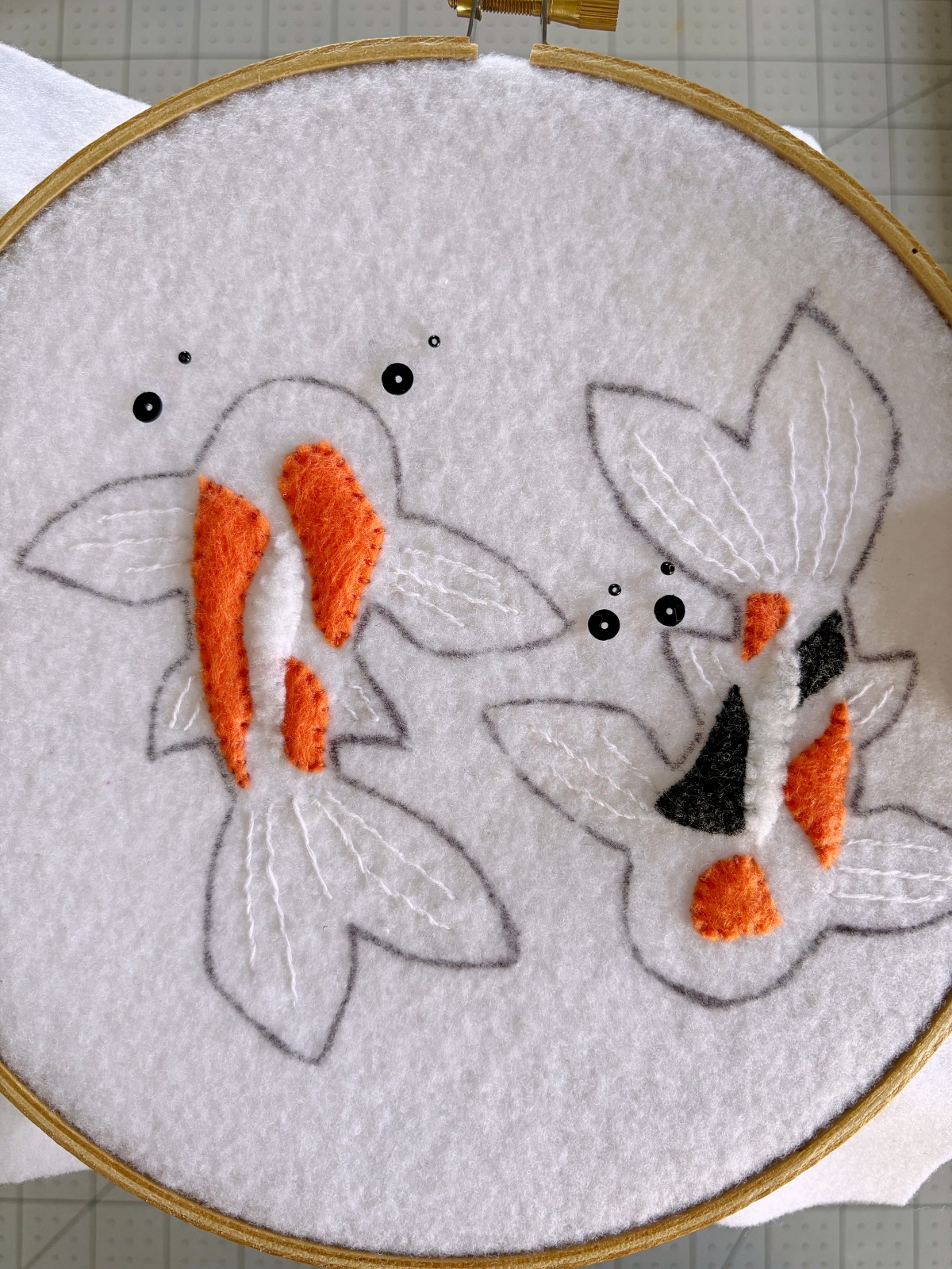 Koi fish bases with black seed beads and sequins for the eyes.