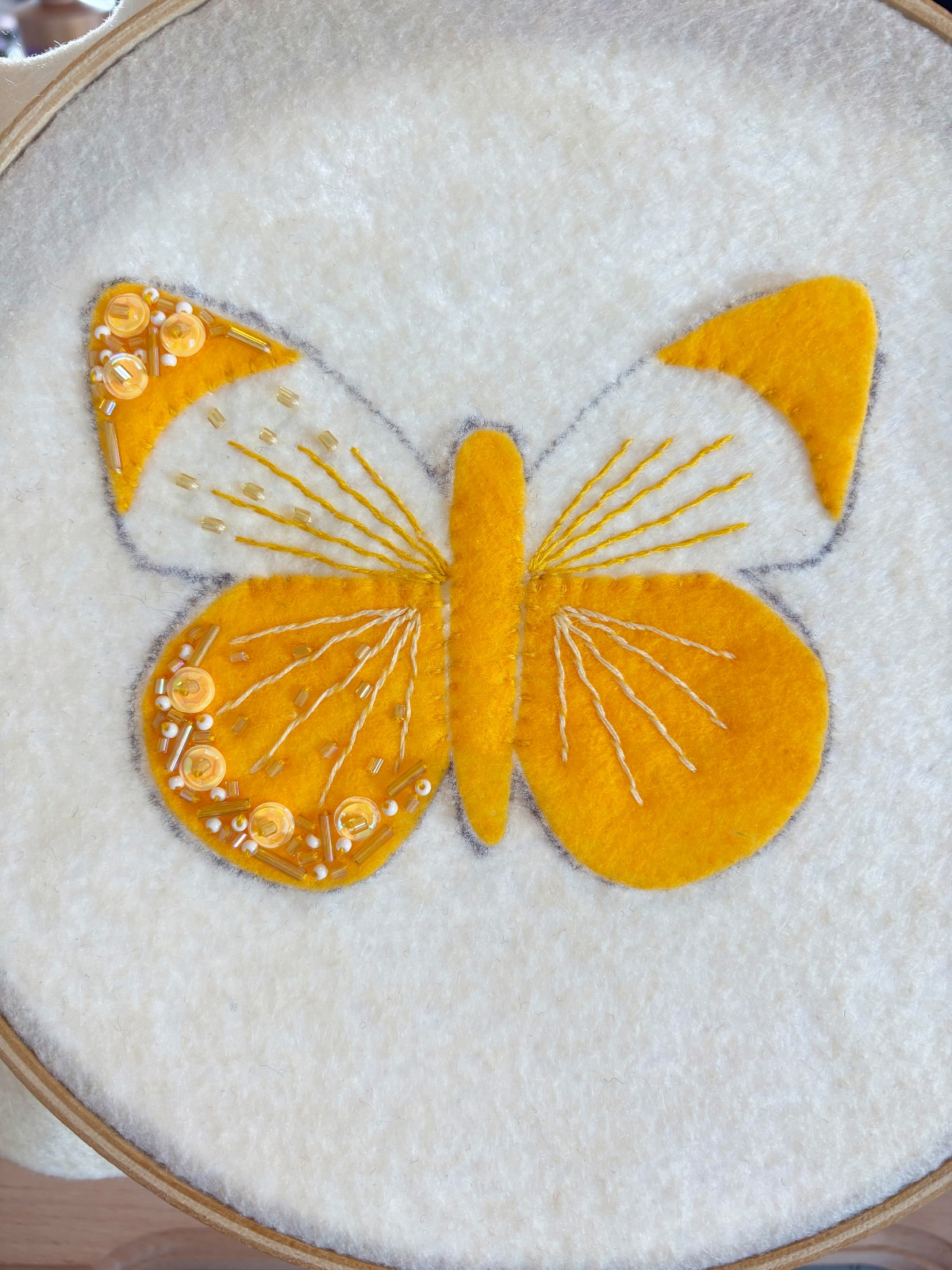 Butterfly ornament with half the wing details finished.