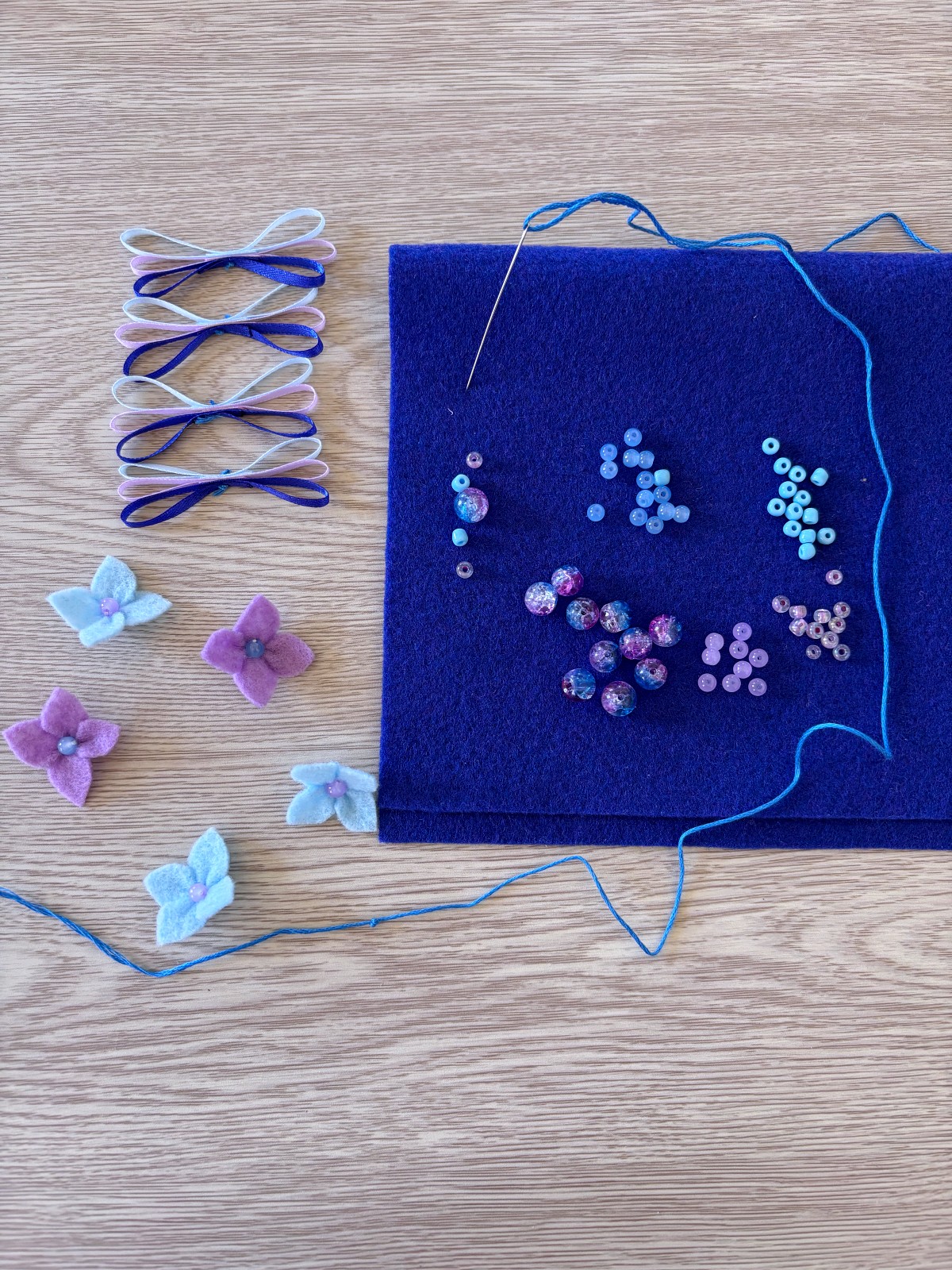 Materials for assembling the flower crown all laid out on a table.