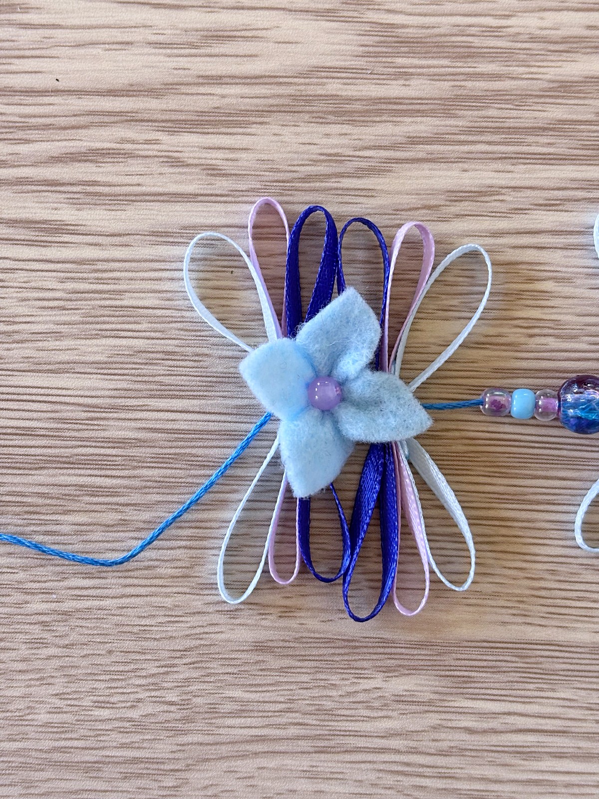 Blue felt flower added to the flower crown.