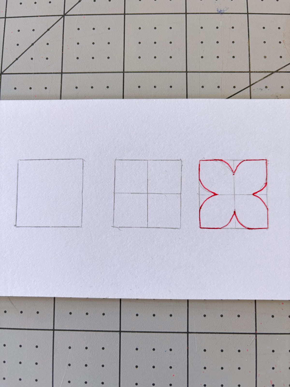 Felt flower pattern drawn on paper.