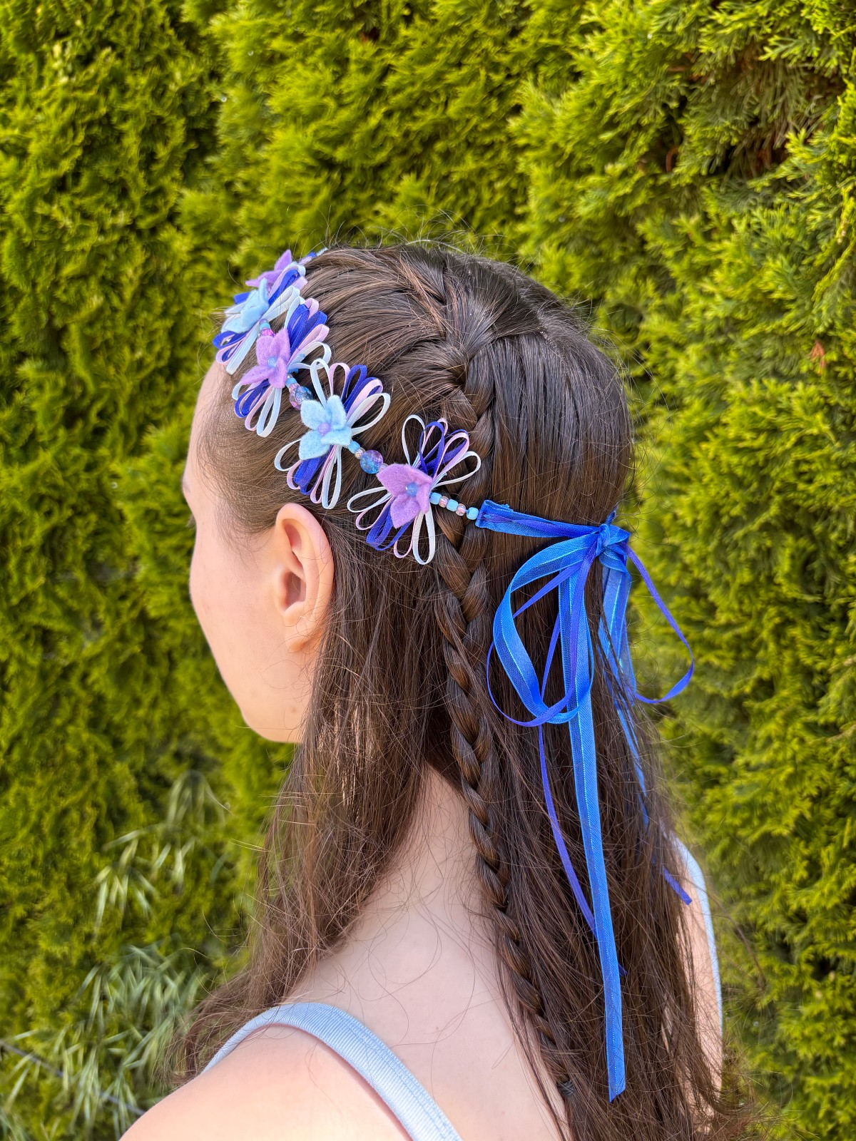 Side view of the finished flower crown on a head.