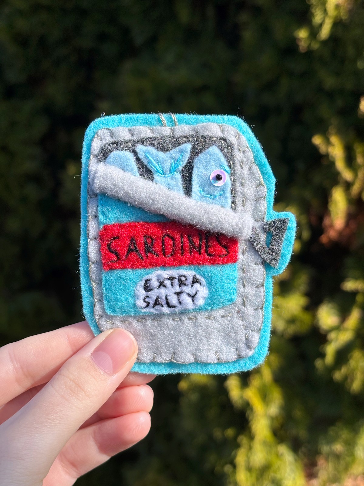 Sardine can felt ornament.