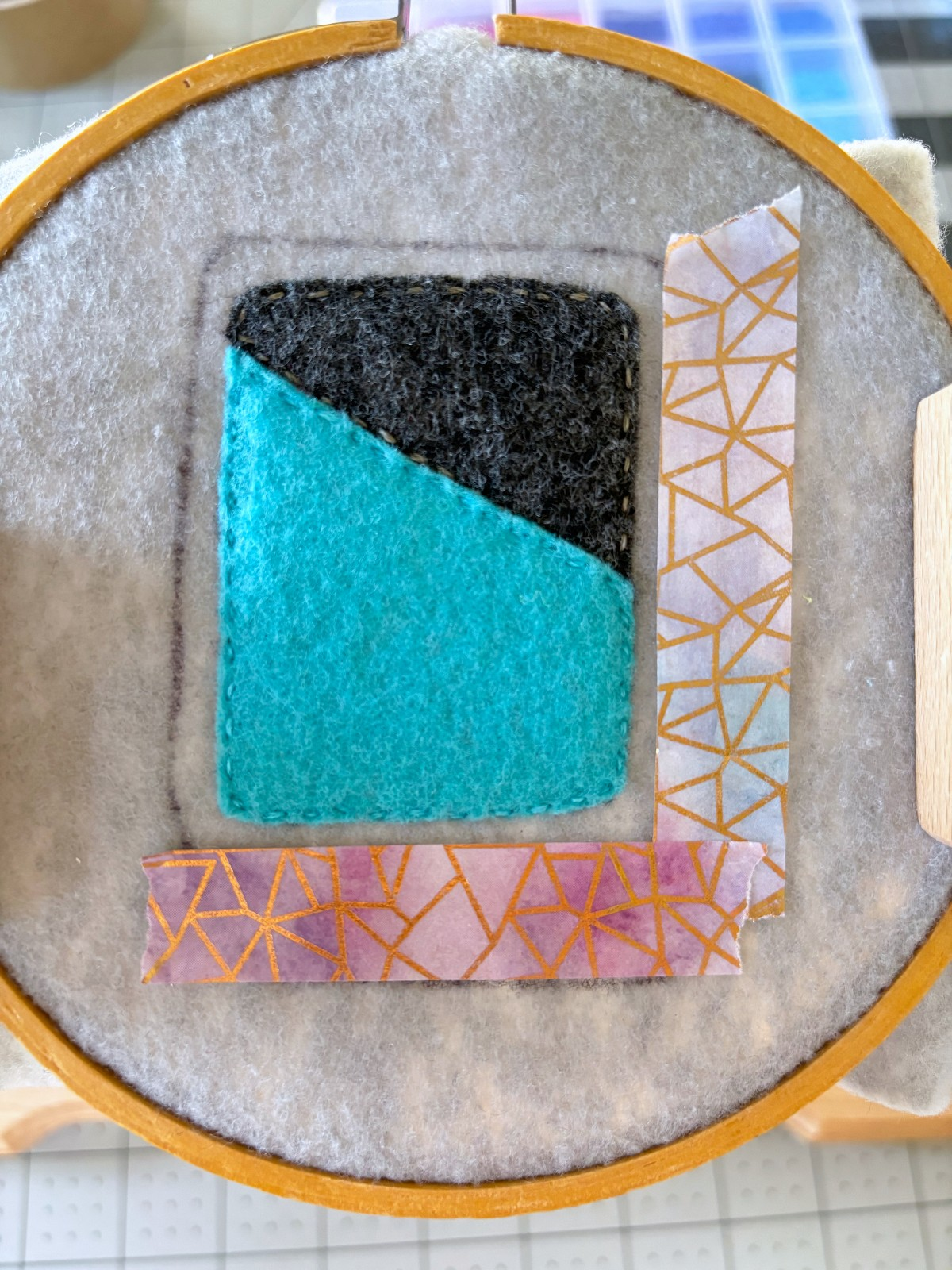 Washi tape guide lines for sewing on the embroidery details to the ornament base.