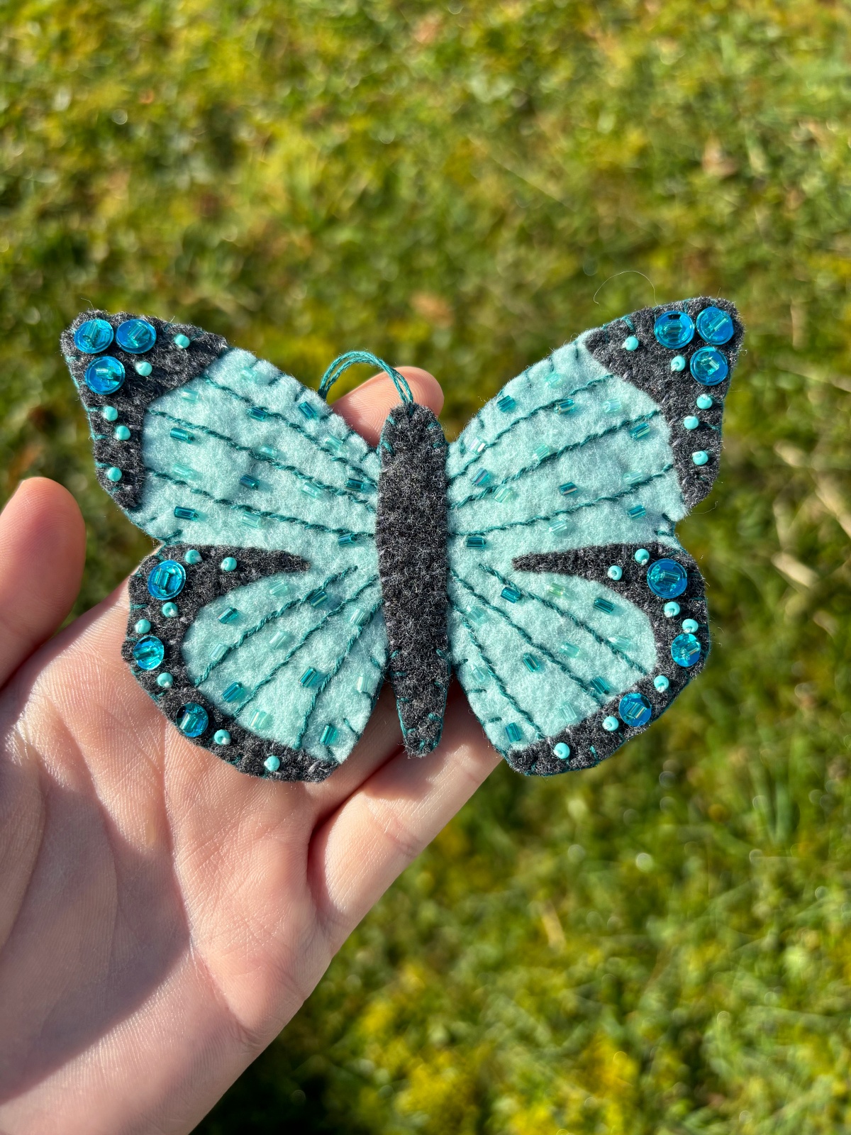 Finished teal butterfly ornament.