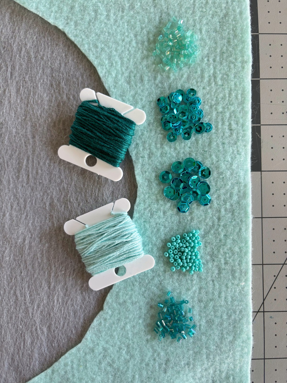 Felt, beads, and sequins.