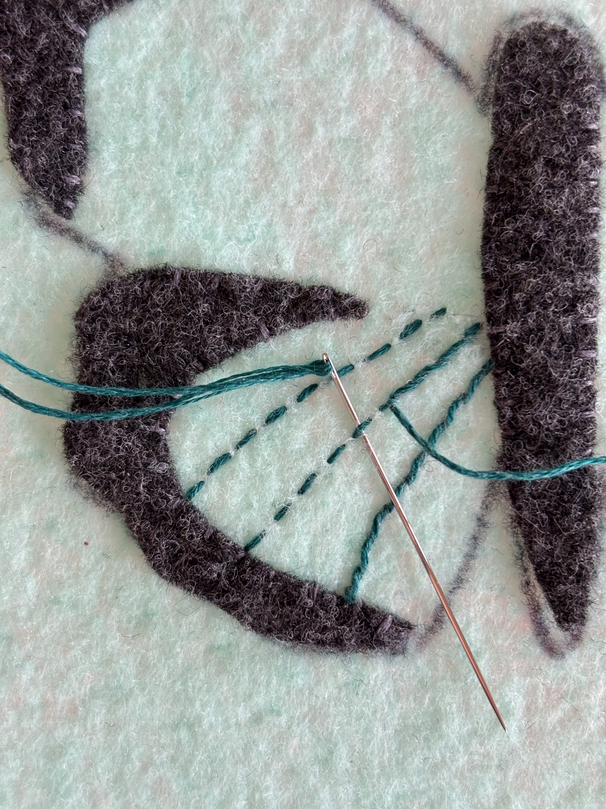 embroidery details on the bottom wing of the butterfly.