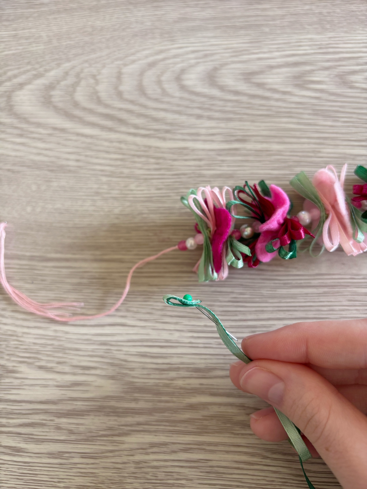 Ribbon ties folded with sewing pin holding it in place.