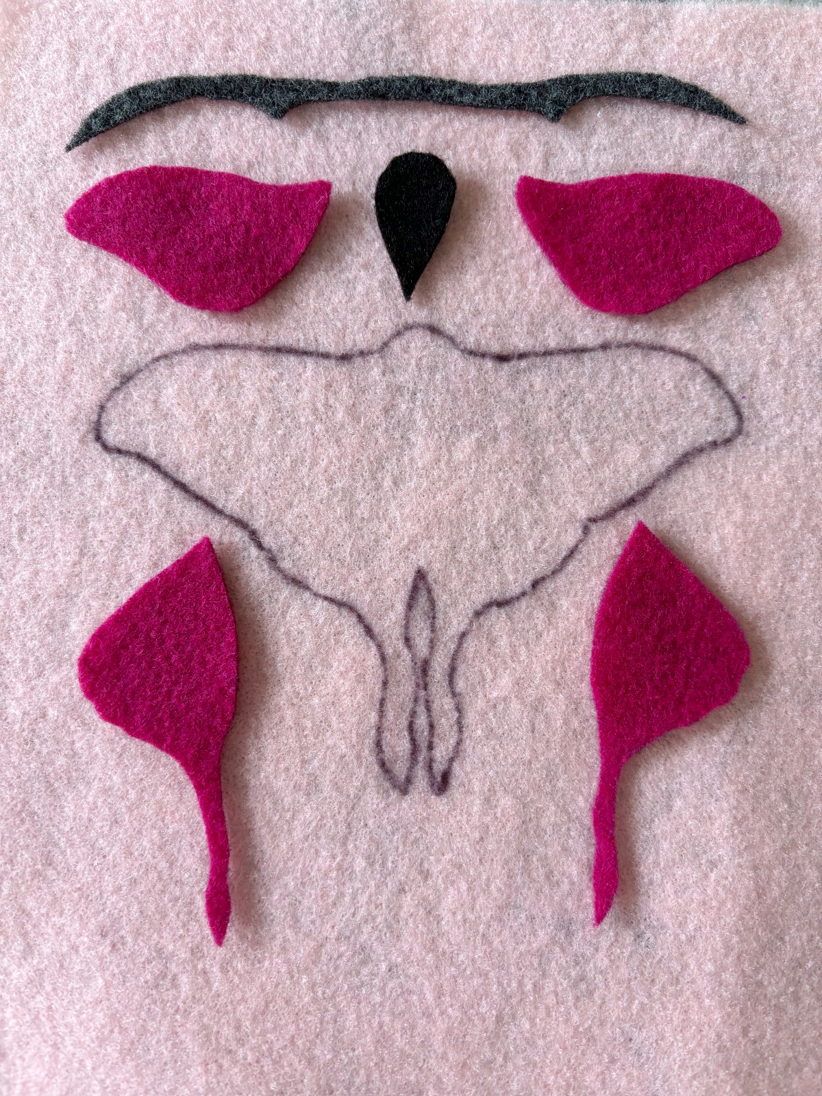Pattern pieces traced and cut out from felt.