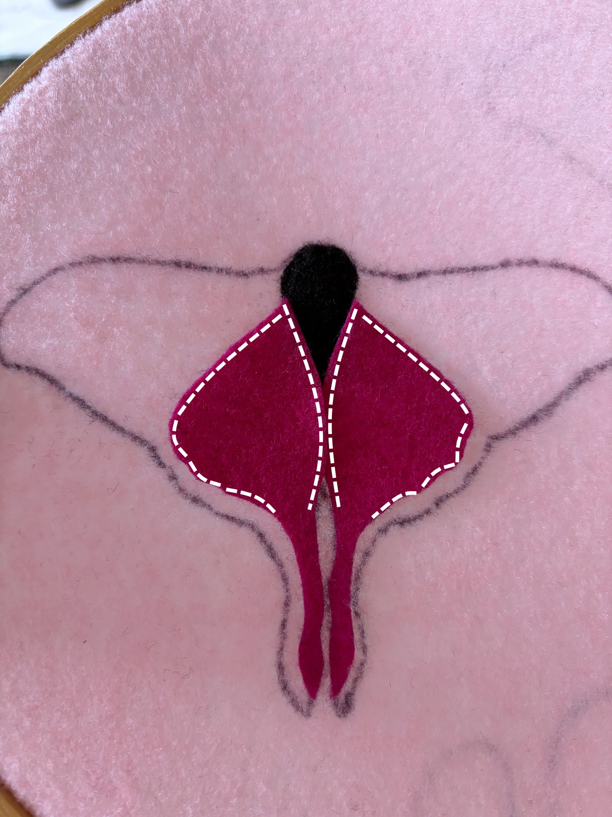 Bottom wings with sewing instructions indicated by a dashed white line. 