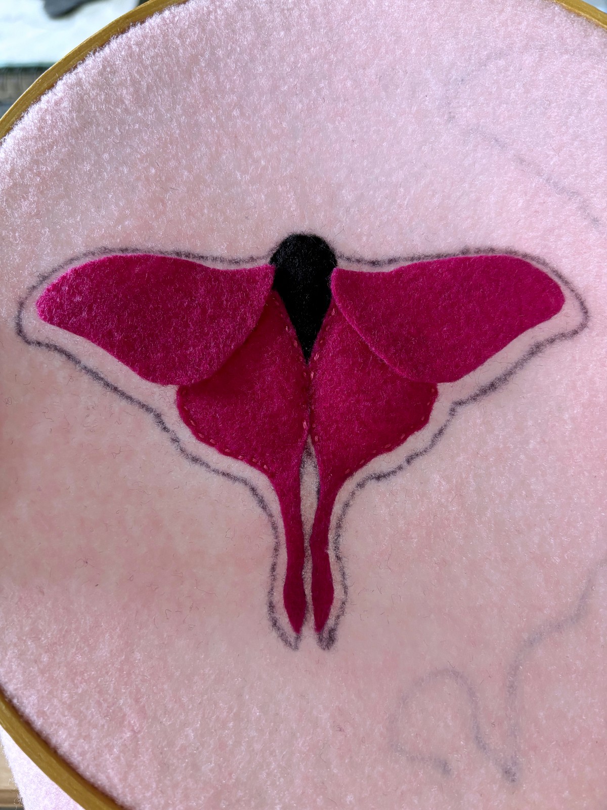 Upper top wings placed on pink base.